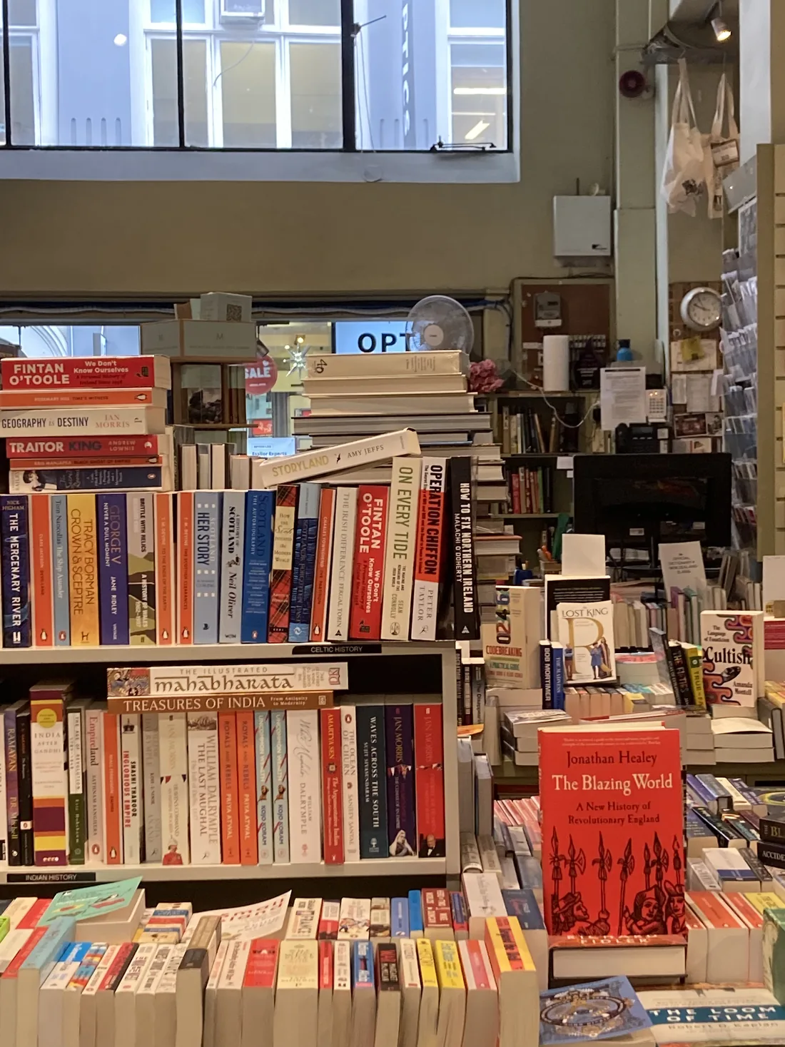 A busy secondhand bookshop stacked with books