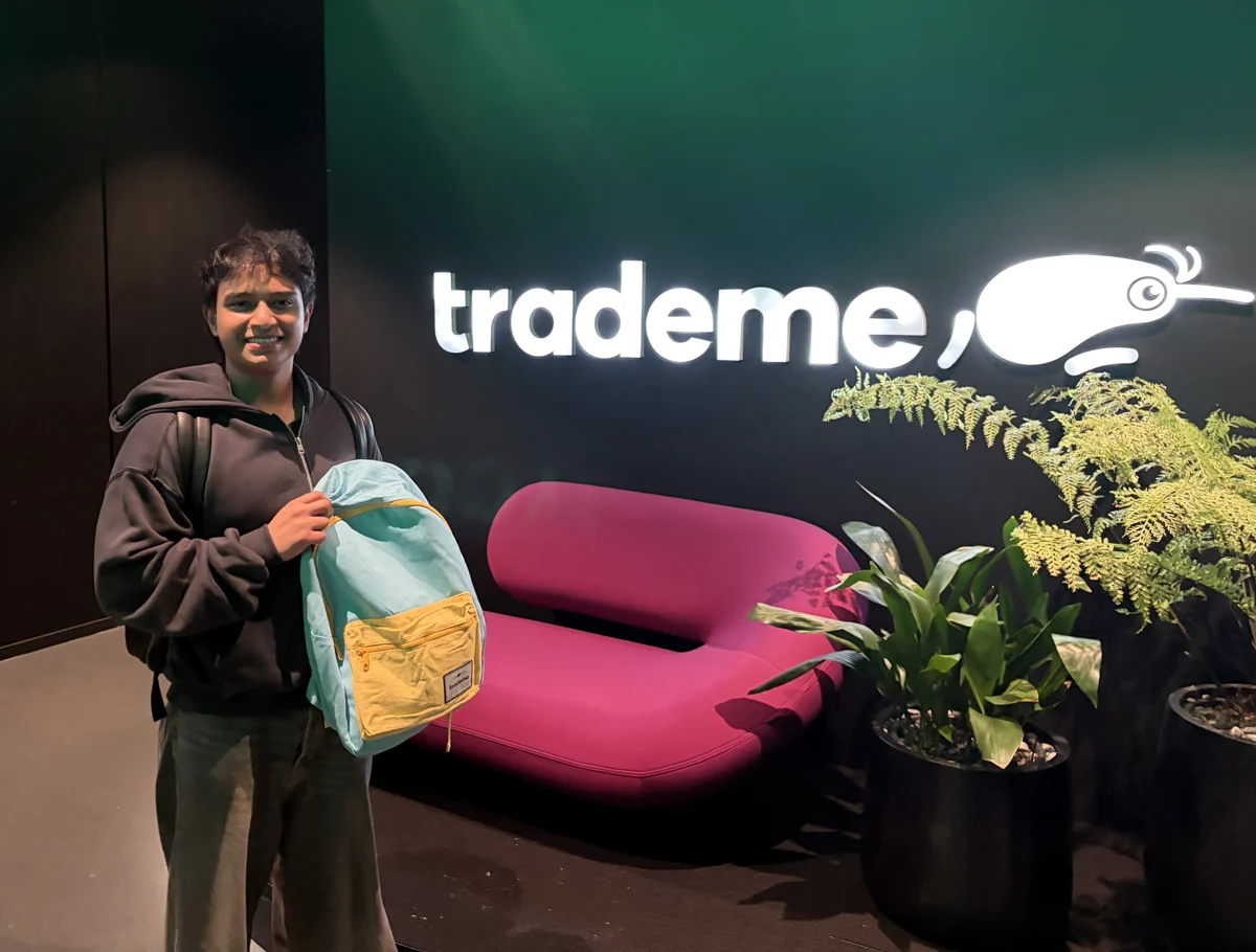 Aaditha at the Trade Me office holding a backpack