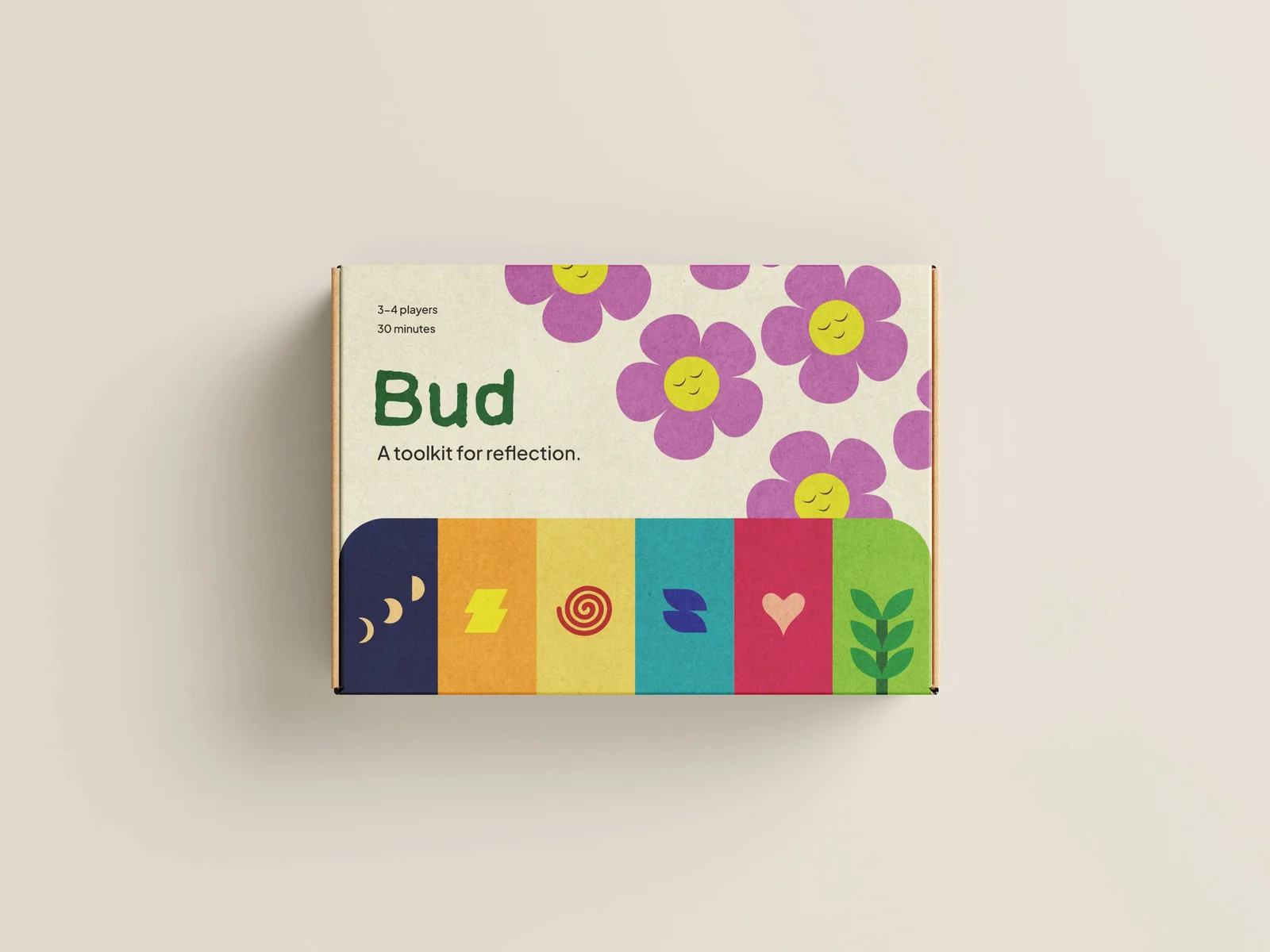 The finished Bud toolkit box — 'Bud, a toolkit for reflection' with the flower logo and colourful theme bands