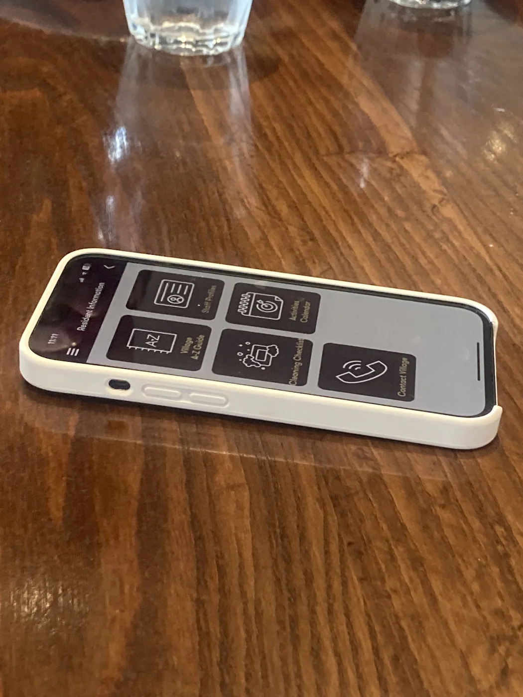 The existing Oceania resident-information app on a phone