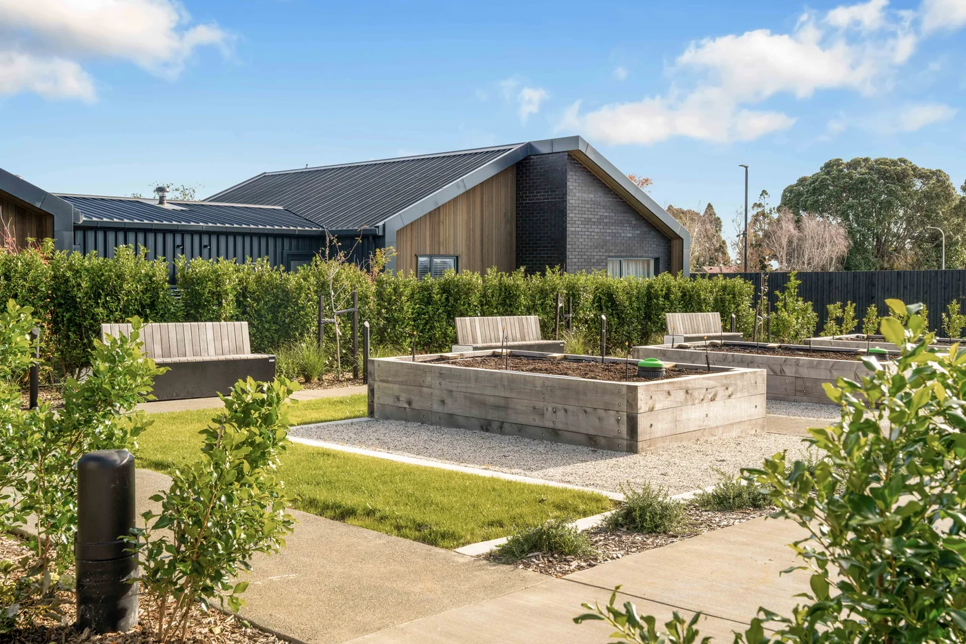 Raised garden beds and paths at Oceania's Franklin village